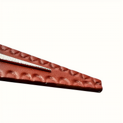 Gros pla sur da texture du cuir de la boucle d'oreille émbossée